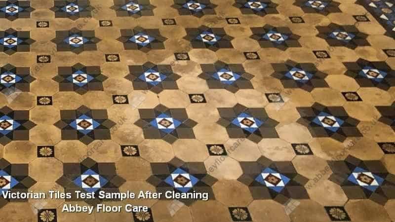 Cleaned Victorian tile sample in Farnham showing restored colour contrast
