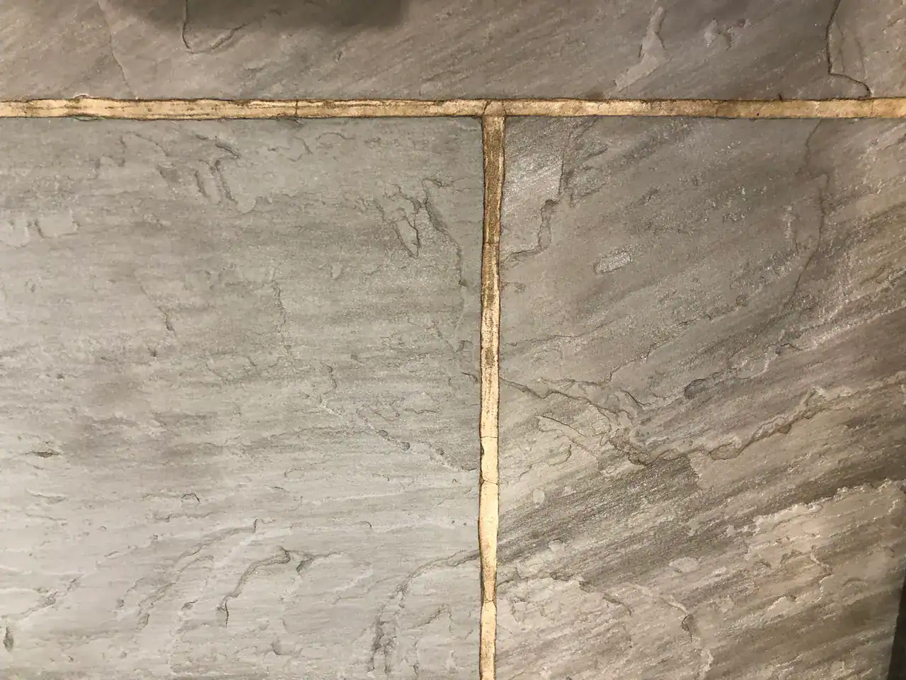 Professional slate floor restoration assessment prior to choosing cleaning, repair, or sealing route