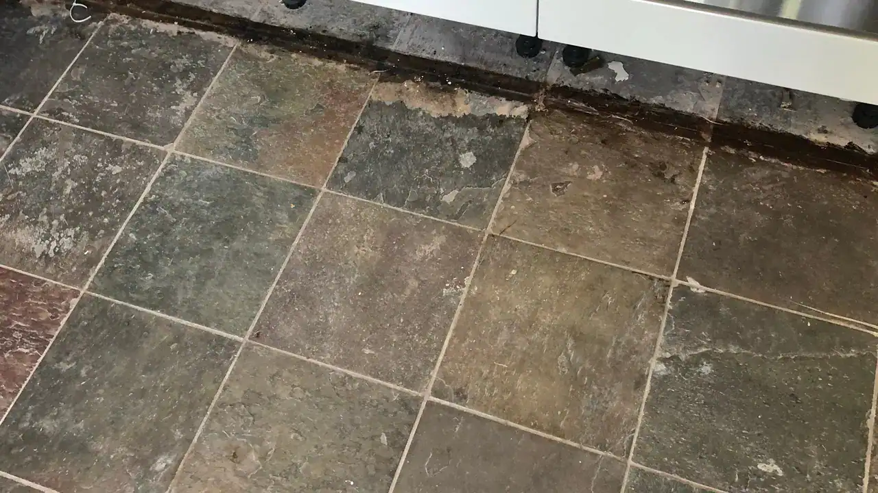 Worn slate floor illustrating the stages of cleaning, repair, sealing, and restoration